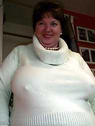 Lusty mature whore is posing undressed for a photoshoot