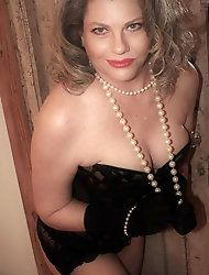 Seductive mature mademoiselle is taking off her underwear for a photoshoot