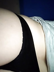 A mature woman displaying her breasts