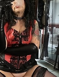 The mistress is smoking a cigar through a sex toy